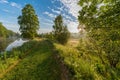 Early summer morning at a trail near a channel Royalty Free Stock Photo