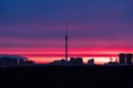 Early sunrise over dark city park and TV tower Royalty Free Stock Photo