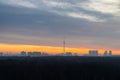 Early winter dawn over forest and city on horizon Royalty Free Stock Photo