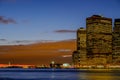 Early winter evening and the New York City Skyline at sunset showing the lower manhattan area with Wall street and the statue Royalty Free Stock Photo