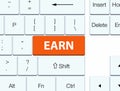 Earn orange keyboard button Royalty Free Stock Photo