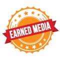 EARNED MEDIA text on red orange ribbon stamp