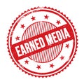 EARNED MEDIA text written on red grungy round stamp