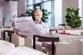 Earnest mature man reading newspaper Royalty Free Stock Photo