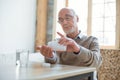 Earnest senior man taking medication Royalty Free Stock Photo