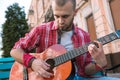 Earnest street musician developing his musical skills
