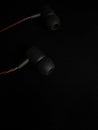 Earphone in a black background