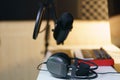 Earphone, Condenser microphone and sound mixing console board. Equipment for the music studio Royalty Free Stock Photo