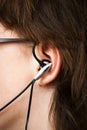 Teenager with earbud