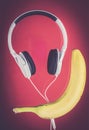 Earphones and banana popart fitness