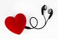 Earphones in heart shape - Concept of love Royalty Free Stock Photo