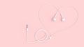 Earphones white color on pastel pink background