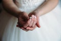 Earring in the hands of the bride Royalty Free Stock Photo