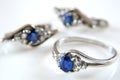 Earring and ring set with big blue sapphire and white diamonds around, jewerly shop, pawnshop concept