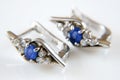 Earring and ring set with big blue sapphire and white diamonds around, jewerly shop, pawnshop concept