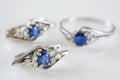 Earring and ring set with big blue sapphire and white diamonds around, jewerly shop, pawnshop concept