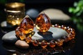 Earrings and bracelet with amber stones. Royalty Free Stock Photo