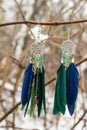 earrings of Dream catcher with feathers threads and beads rope hanging. Dreamcatcher handmade Royalty Free Stock Photo