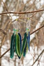 earrings of Dream catcher with feathers threads and beads rope hanging. Dreamcatcher handmade Royalty Free Stock Photo