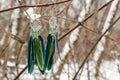 earrings of Dream catcher with feathers threads and beads rope hanging. Dreamcatcher handmade Royalty Free Stock Photo