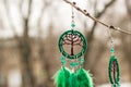 earrings of Dream catcher with feathers threads and beads rope hanging. Dreamcatcher handmade Royalty Free Stock Photo