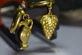The earrings are gold decorated with genuine diamonds.