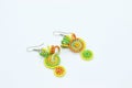 Earrings made by knitting with colored threads Royalty Free Stock Photo