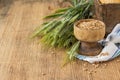 Ears of barley and wheat on the wooden background Royalty Free Stock Photo