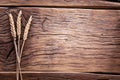 Ears of wheat on old wood. Royalty Free Stock Photo