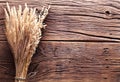 Ears of wheat on old wood. Royalty Free Stock Photo