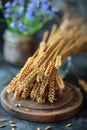 The ears of wheat are on the table. The harvested wheat crop