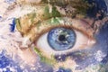 Earth awakening concept, save the planet. Close up image of woman face with earth painted. Creative composite of macro Royalty Free Stock Photo