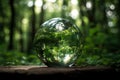 Earth Day April 22, beautiful reflections and magnified distorted leaves and trees in crystal glass ball in forest, AI