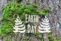 Earth day banner decorated hand drawn leave on the green moss tree bark background Royalty Free Stock Photo