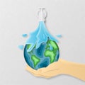 Earth day everyday concept in paper cut style. 3d paper art. Origami made a Water flows down from the pipe on carving earth map Royalty Free Stock Photo