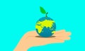 The earth day. hand holding the planet and little hero tree on top. let`s plant a tree for your child`s future. Royalty Free Stock Photo