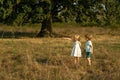 Earth day. Little family farmers. Eco farm for kids. Children farmer in the farm with countryside background. Springtime