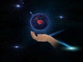 Earth day with red heart sumbol in hands on front blue starry sky nebula hold world peace globe concept nature background