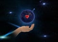 Earth day with red heart sumbol in hands on front blue starry sky nebula hold world peace globe concept nature background