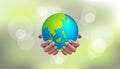 Earth day save our planet concept. Human hands holding globe with bokeh blur background. World environment day. go green. Royalty Free Stock Photo