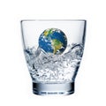 Earth drowning in a glass of water Royalty Free Stock Photo