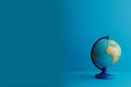 Earth globe on clean blue banner background. Education, school, study and knowledge background Generative AI. Royalty Free Stock Photo
