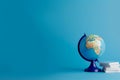 Earth globe on clean blue banner background. Education, school, study and knowledge background Generative AI. Royalty Free Stock Photo