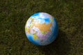 Earth globe in the grass Royalty Free Stock Photo