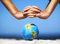 Earth globe with hands over it. Conceptual image Royalty Free Stock Photo