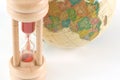 Earth globe and hour glass Royalty Free Stock Photo