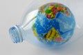 Earth globe in plastic bottle - Concept of plastic pollution and ecology Royalty Free Stock Photo