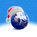 Earth globe and santa hat Royalty Free Stock Photo