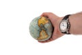 Earth globe shows continent america in a human hand and the watch shows high time