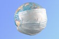 Earth globe with surgical mask Royalty Free Stock Photo